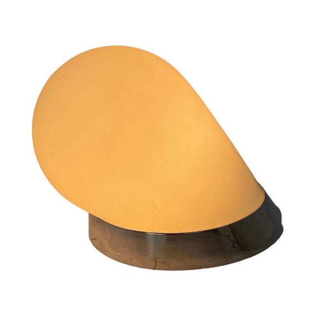 Italian glass lamp made by Tre Ci Luce Milano. Wall sconce on chrome colored base that houses an original Murano silk...