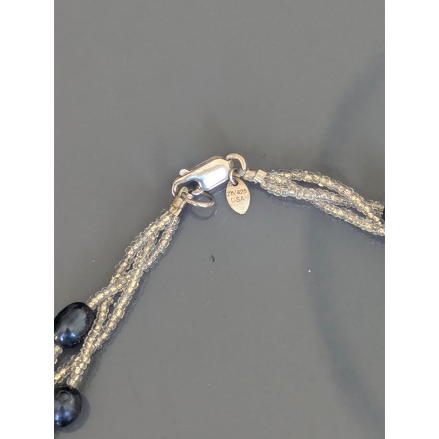 ZIV is a designer of jewelry surrounding 925 Stirling silver. The freshwater pearl alternating with crystal beads....
