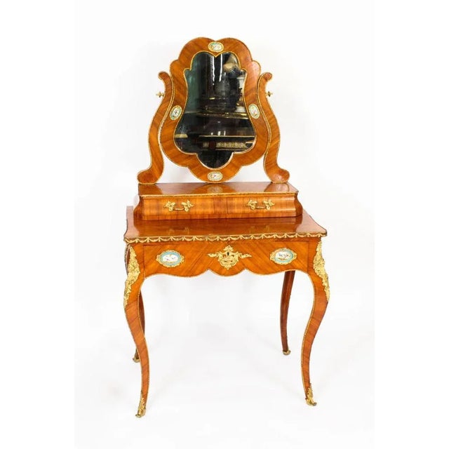 This is a beautiful antique French bois de Violette, ormolu and Sevres porcelain mounted dressing table circa 1860 in...