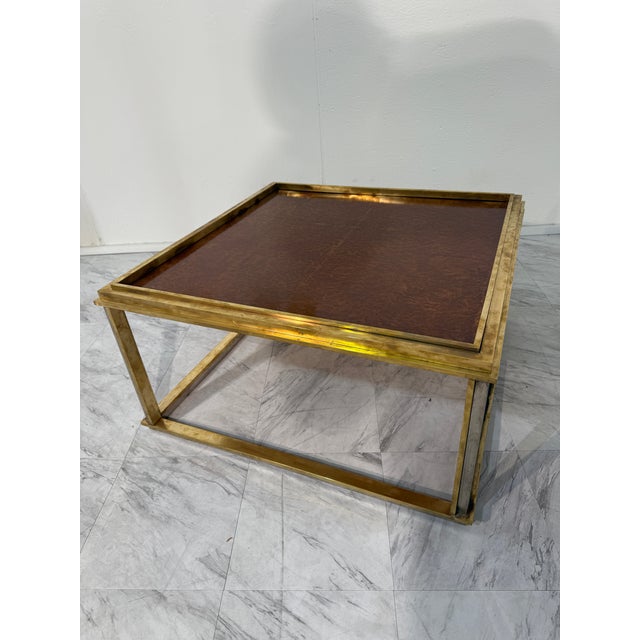 A refined square coffee table by renowned Italian designer Romeo Rega, crafted in the 1970s. This square table features a...
