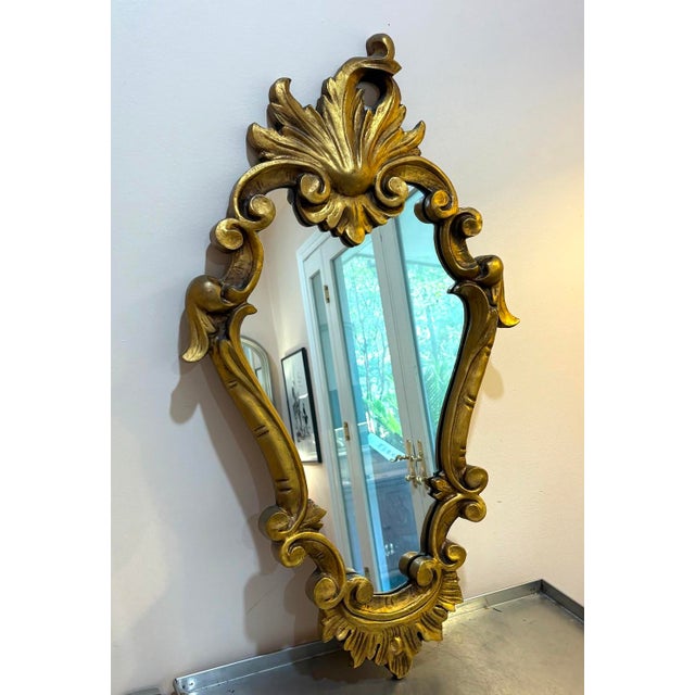 Early 20th-century French style giltwood frame wall mirror. Excellent condition. Measures 35" x 20" including frame.