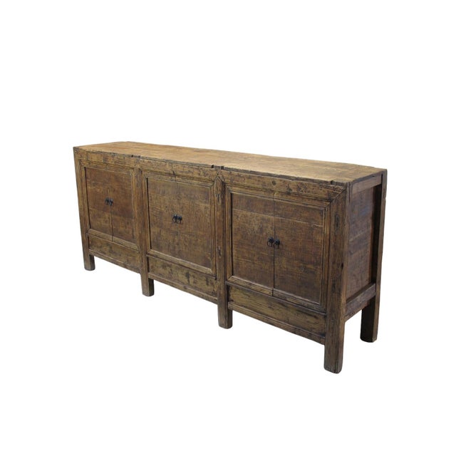 Handcrafted from solid poplar, this brutalist sideboard embodies raw, unrefined beauty with its heavy frame and natural...