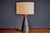 This ceramic table lamp channels the sculptural character of mid-century Italian studio design into a compact,...