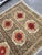 Vintage Suzani from Samarkand, circa 1900s. There is colour bleeding in certain sections of the image. It is visible in...