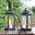 Elevate your outdoor ambiance with the Lirio Small lantern set. Standing confidently at 17.5 inches, these black iron and...