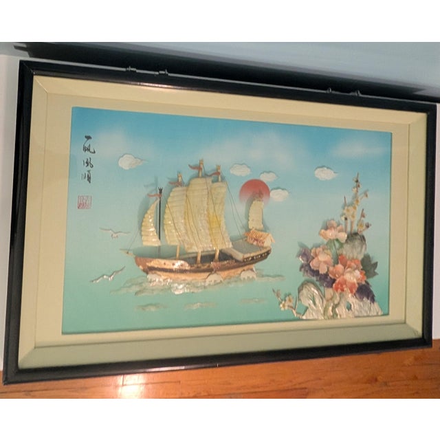This is a traditional Chinese shell carving relief (贝雕, bèidiāo or 螺钿, luódiàn), a craft where sea shells and mother-of-...