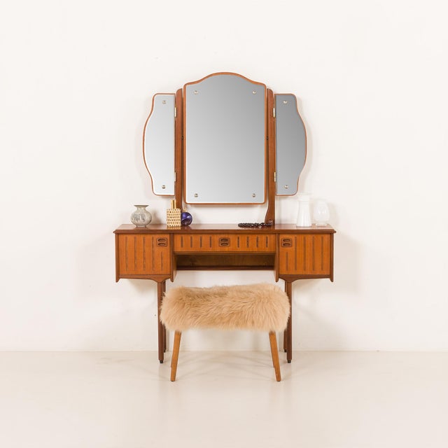 The elegant Scandinavian mid-century teak dressing table 1960s and 1970s, comes from Norway. The dressing table features a...