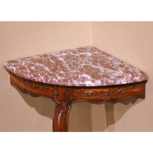 Decorate a corner or entryway with this elegant antique French console table crafted in oak circa 1780. Built in the Louis...