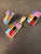 This jewelry set is a pair of sterling silver channel inlay earrings featuring a mosaic of multiple colored stones. This...