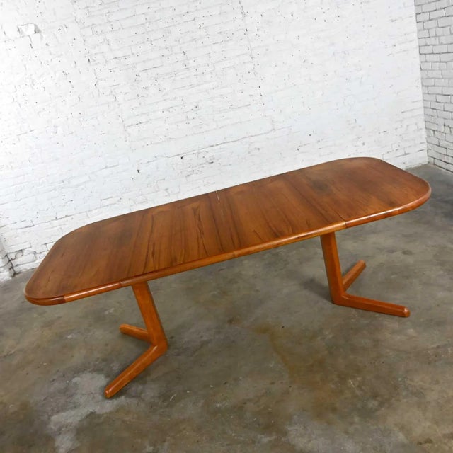 Gorgeous vintage teak Scandinavian Modern expanding dining table with 2 leaves. Unmarked but style of Neils Moller for...