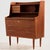 Danish teak bureau desk in restored condition with six drawers and extendable writing board from the 1960s. The furniture...