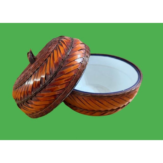 A vintage pumpkin with a great story, featuring a rich herringbone pattern and a smooth white enameled interior, the...