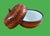 A vintage pumpkin with a great story, featuring a rich herringbone pattern and a smooth white enameled interior, the...