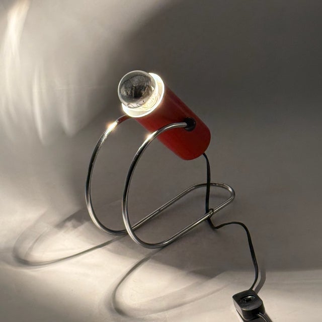 Stunning 1960s Targetti Sankey tube table lamp, a Mid-Century Modern masterpiece featuring a bold orange-red cylindrical...