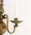 Pair of Dutch Style Bronze Two-Branch Wall Sconces, with orb-form backing plate. 14.75" H x 11" W x 7.5" D. Provenance:...