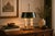 French-style bouillotte table lamp dating to the 1950s, with two candle-style light fittings above a scalloped brass base....