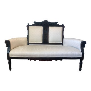 Victorian Aesthetic Movement Carved Walnut Settee With Ivory Upholstery For Sale