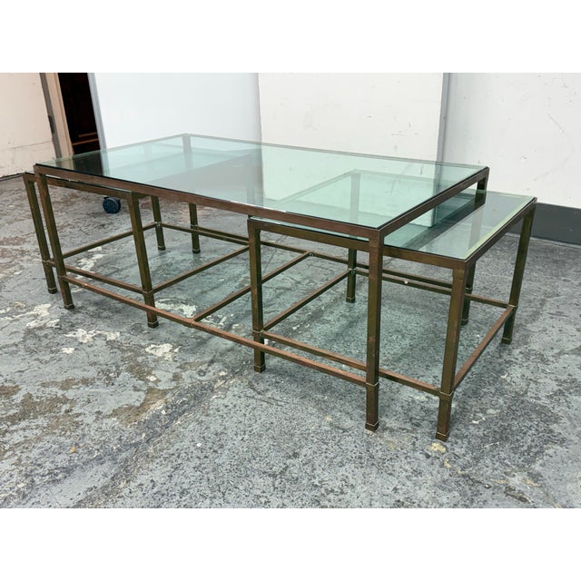 Design Plus Gallery presents a Set of Three Nesting Tables from Coup d'Etat. The set of tables is a mixed use of tones...