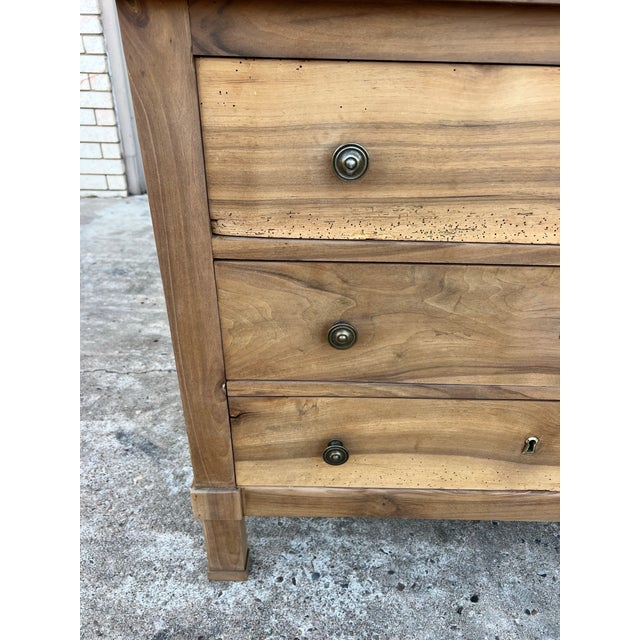 Elegant French Empire commode featuring three spacious drawers in beautifully aged, naturally figured walnut, with the top...