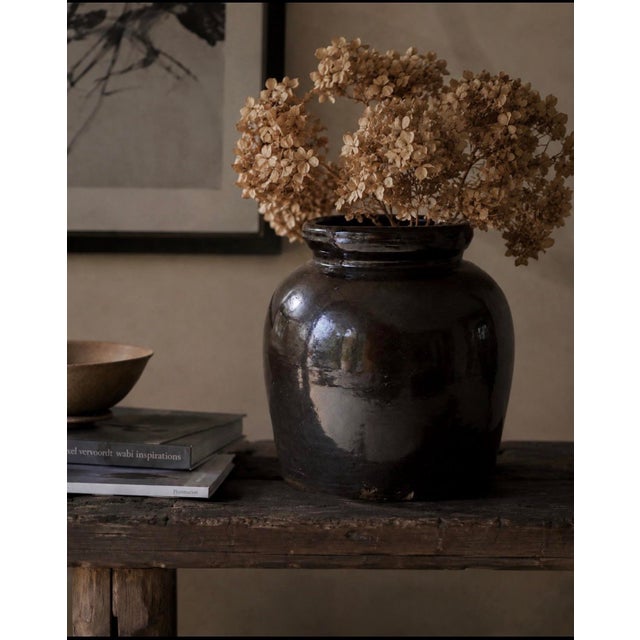 A beautifully preserved example of American utilitarian stoneware, this substantial storage jar features the deep,...
