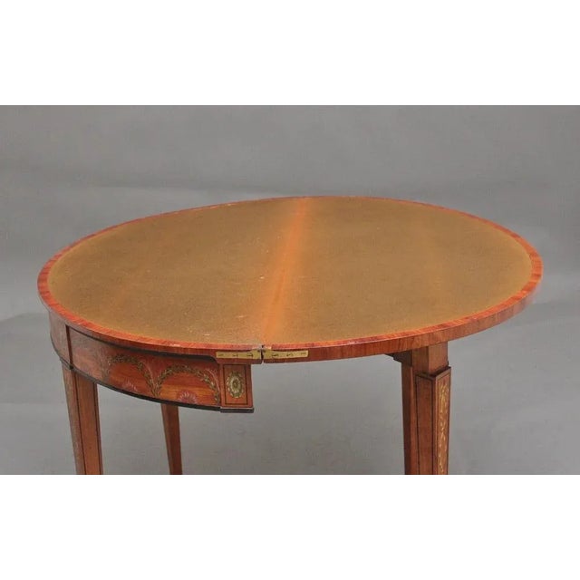 A highly decorative and fabulous quality early 19th Century painted satinwood card/games table in the Sheraton style,...