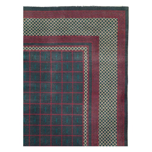 A vintage Indian Lahore room size carpet handmade during the mid-20th century with an Art Deco inspired bold and geometric...