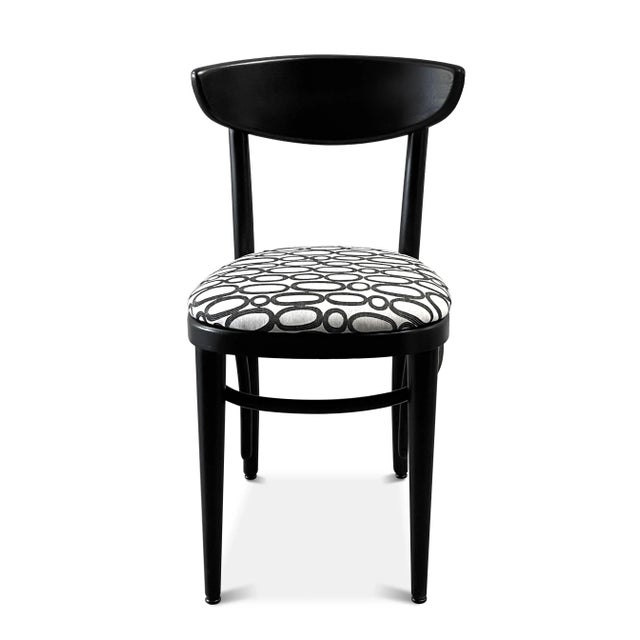 A Thonet bentwood side chair from the 1940s. The mid-century bistro chair has been sanded and painted a satin black, with...