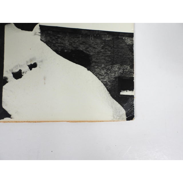 Vintage Continental snowy winter rooftop photograph. Unsigned. Unframed, mounted on cardboard backing, small corner crease.