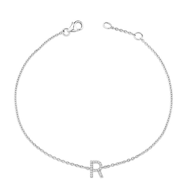 Immerse yourself in the understated elegance of this 10K white gold bracelet, rhodium-plated for an enrapturing shimmer...