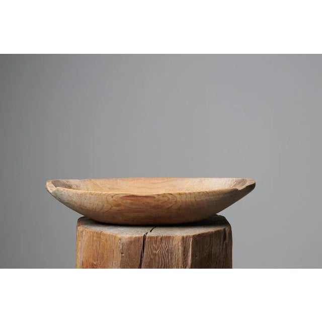 Antique wood trough bowl in folk art from Sweden made during the mid 1800s, around 1850. The bowl is a utility item which...