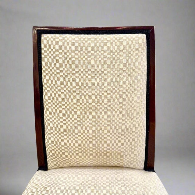 A pair of Art Deco side chairs. Stained beechwood with fluted leg details.