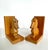 Pair of wooden hand crafted bookends by Dobin, Switzerland. Each piece is carved in the shape of a dachshund or basset...