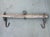 This authentic antique wall-mounted rack features a weathered solid wood beam fitted with original hand-forged iron...
