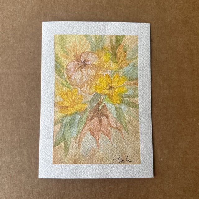 A delicate and dreamy watercolor floral painting featuring warm yellow and earthy tones. The soft blending of colors and...