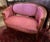 Turn of the century French walnut settee with new upholstery in a beautiful mauve rose color. 55" w x 38.5" h x 23"d