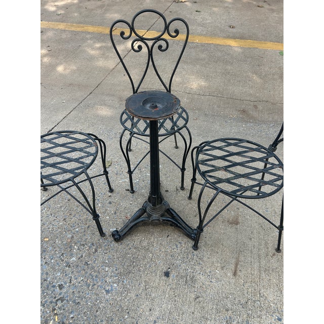 American 1990s Wrought Iron Decorative Patio Set Stone Top Table and 4 Chairs For Sale - Image 3 of 7