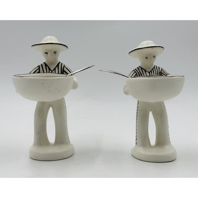 A rare and highly collectible pair of "La Pareja" (The Couple) salt cellars designed by renowned Mexican artist Emilia...