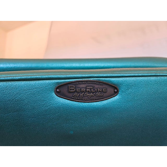 A rare pair of original 50s Berkline mid century modern swivel chairs with genuine chrome aqua green vinyl upholstery. The...