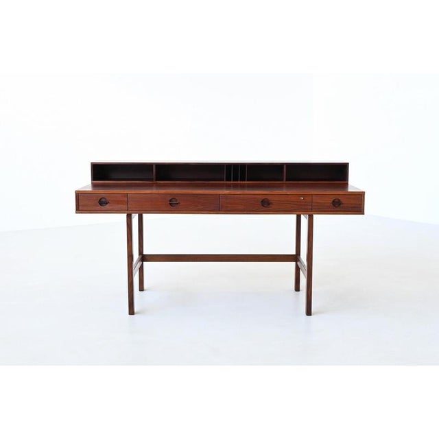 Refined flip-top partners desk designed by Peter Løvig Nielsen and produced by Løvig, Denmark 1954. A celebrated example...