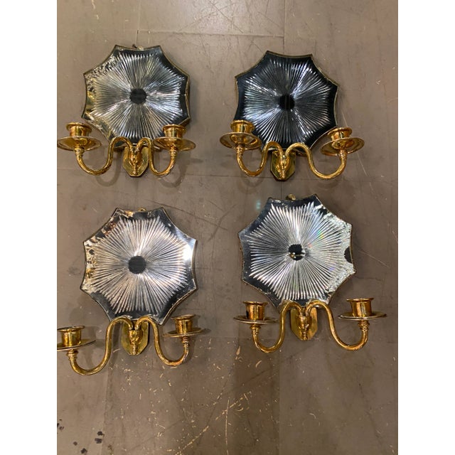 Circa 1920 ‘s gilt bronze and mirror backplate sconces with sun is an etched design. Priced per pair, 3 pairs available