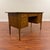 Broyhill Brasilia walnut desk with finished back and cane privacy screen, made in the U.S. in 1965. This iconic mid-...