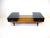A very well crafted solid maple slat wood coffee table with a satin black drawer to each end and a glass top spaning the...