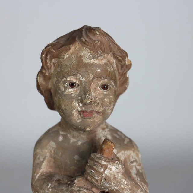 This exquisite set of three antique Italian carved wood figures depicts putti musicians, dating to approximately 1920....