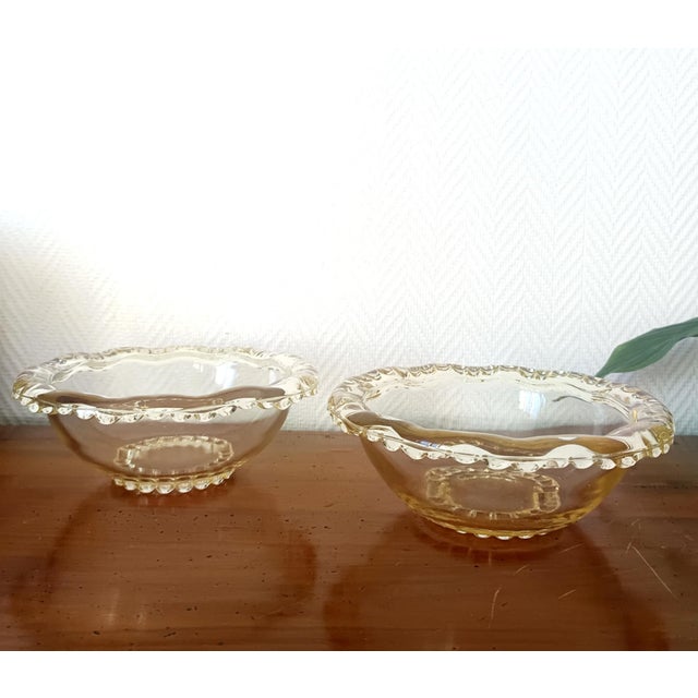 Pair of molded glass bowls, Pierre D'Avesn, circa 1932, millet yellow with a thick, beaded rim. In perfect condition. 24 x...