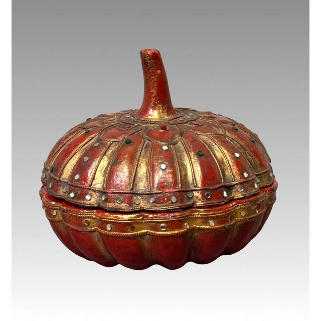 Rare carved gourd shaped Asian box with lacquer and gold finish and decorated with white, green, and red "glass jewels"....