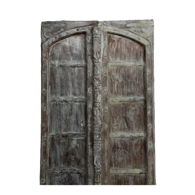 Make a bold vintage statement with these Antique Indo Spanish Arched Doors! Crafted from reclaimed wood, these exterior...