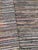 finely made hand knotted modern rug. Multi colored and easy to clean