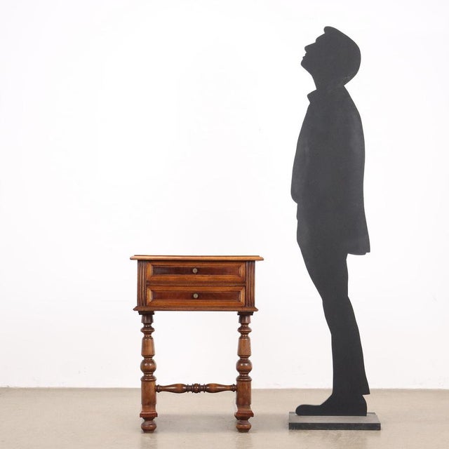 Umbertino period bedside table made with two uprights joined by a turned crosspiece, two drawers on the front, in beech...