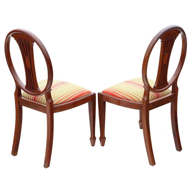 Antique quality pair of Georgian revival inlaid mahogany dining side hall bedroom chairs C1910. Attractively carved with...