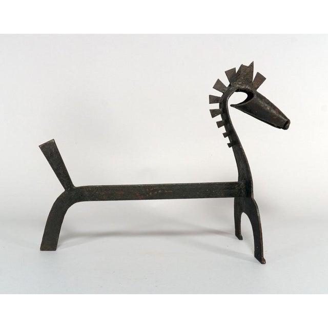 A large and scarce pair of sculptural handmade wrought iron andirons, presented in the shape of horses. Made in Spain in...